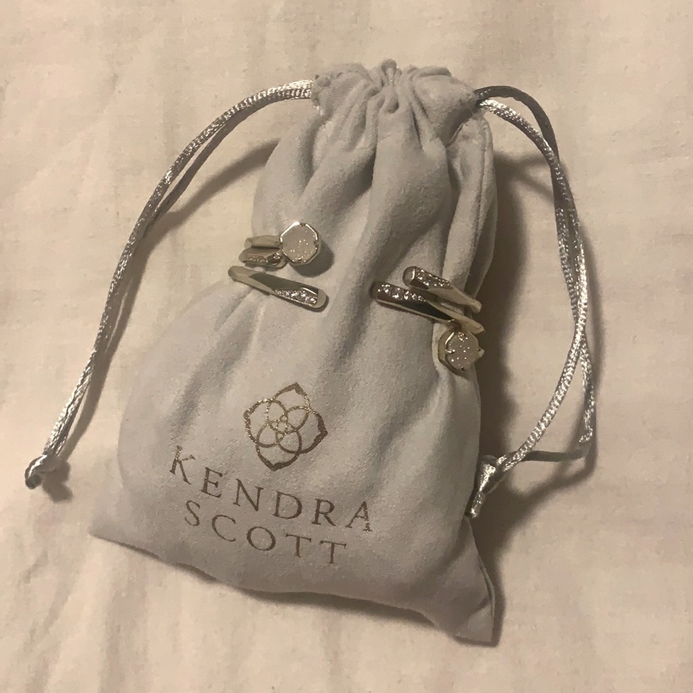 Three gold Kendra Scott bracelets